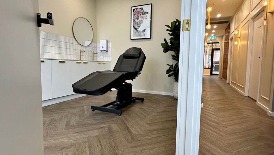 Modern treatment room at X&O Beauty Co, Melbourne, Victoria, AU with sleek decor and comfortable chair.