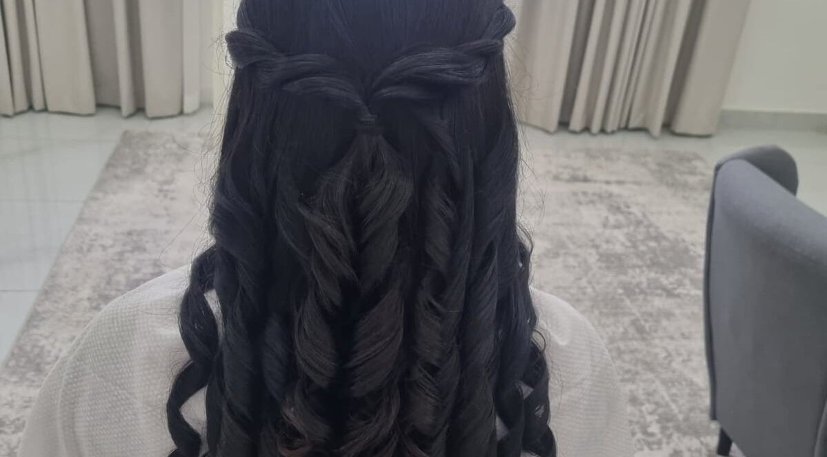 Elegant twisted hairstyle at Renu Beauty Home Salon, Abu Dhabi, Abu Dhabi, AE for a chic look.