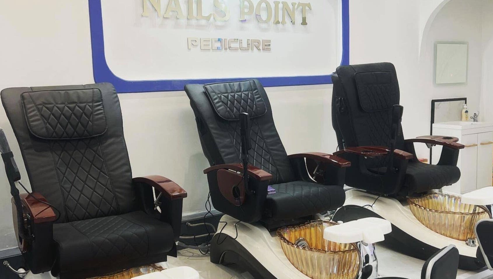 Luxurious pedicure chairs at Nails Point in London, England, GB offering premium wellness services.