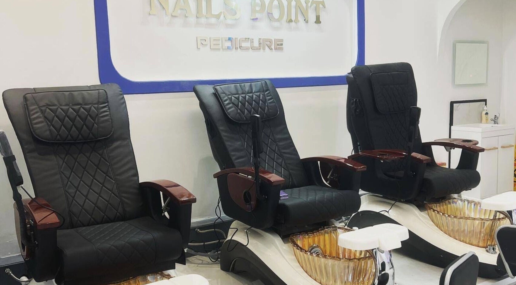 Luxurious pedicure chairs at Nails Point in London, England, GB offering premium wellness services.