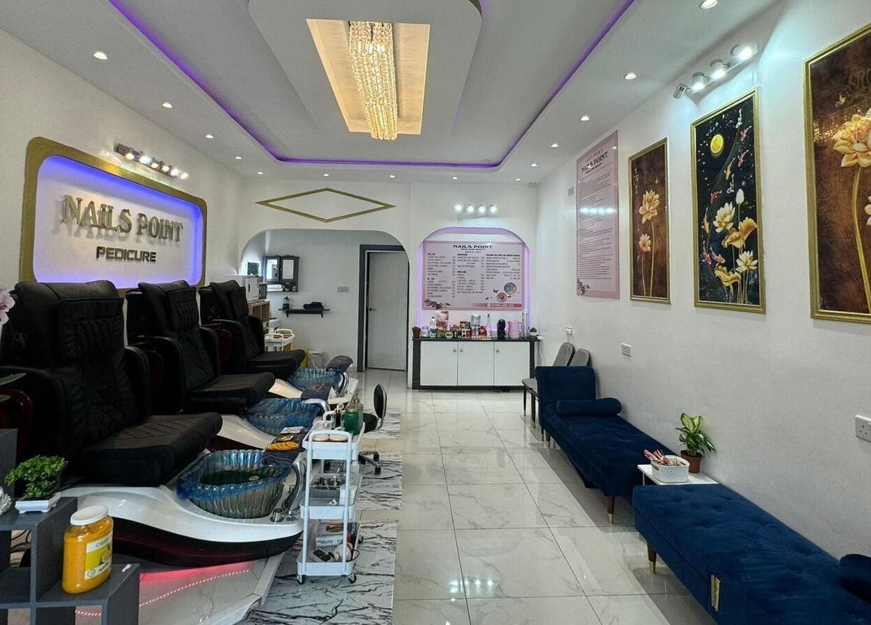 Modern interior of Nails Point, a beauty venue in London, England, GB with elegant decor and comfortable chairs.
