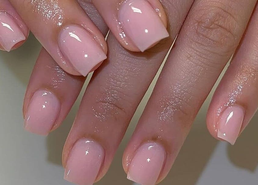 Elegant glossy nails at Nails Point, London, England, GB, showcasing expert manicure artistry.