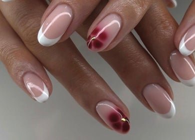 Elegant manicure with floral design at Mashed Nails, Melbourne, Victoria, AU. French tips and red accents.