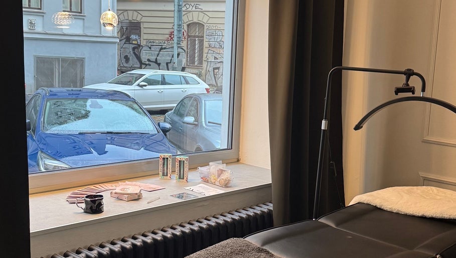 Relaxing ambiance with massage bed at Rituals By Nanda, Praha, CZ, overlooking street view.