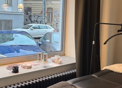 Relaxing ambiance with massage bed at Rituals By Nanda, Praha, CZ, overlooking street view.