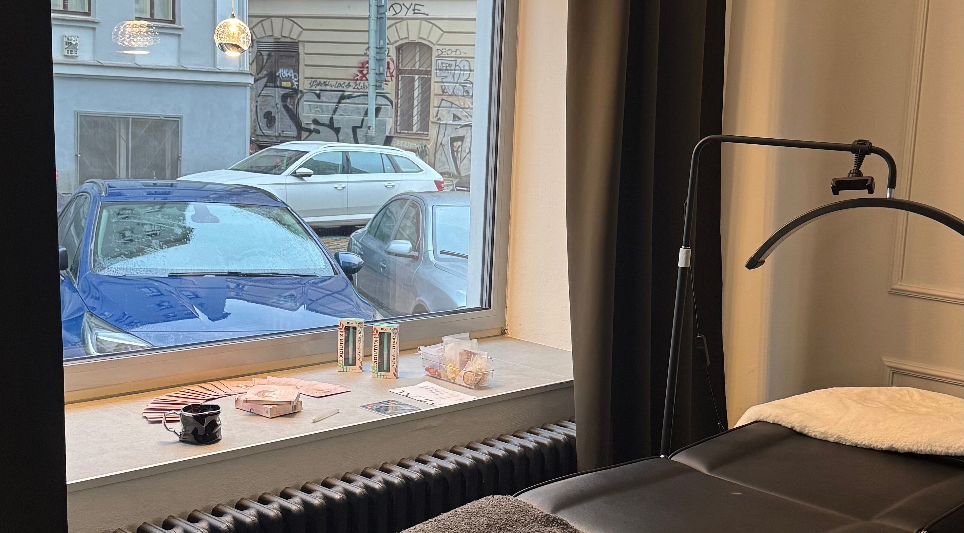 Relaxing ambiance with massage bed at Rituals By Nanda, Praha, CZ, overlooking street view.