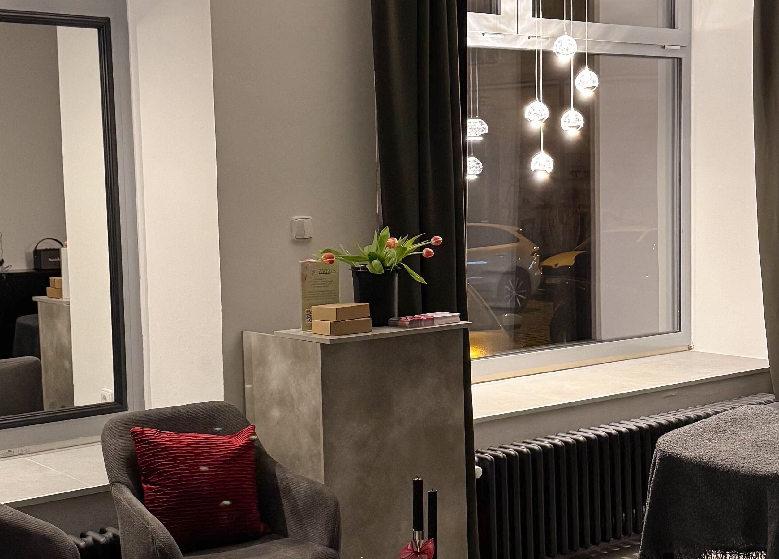 Cozy interior of Rituals By Nanda in Praha, CZ with a modern decor and soft lighting.