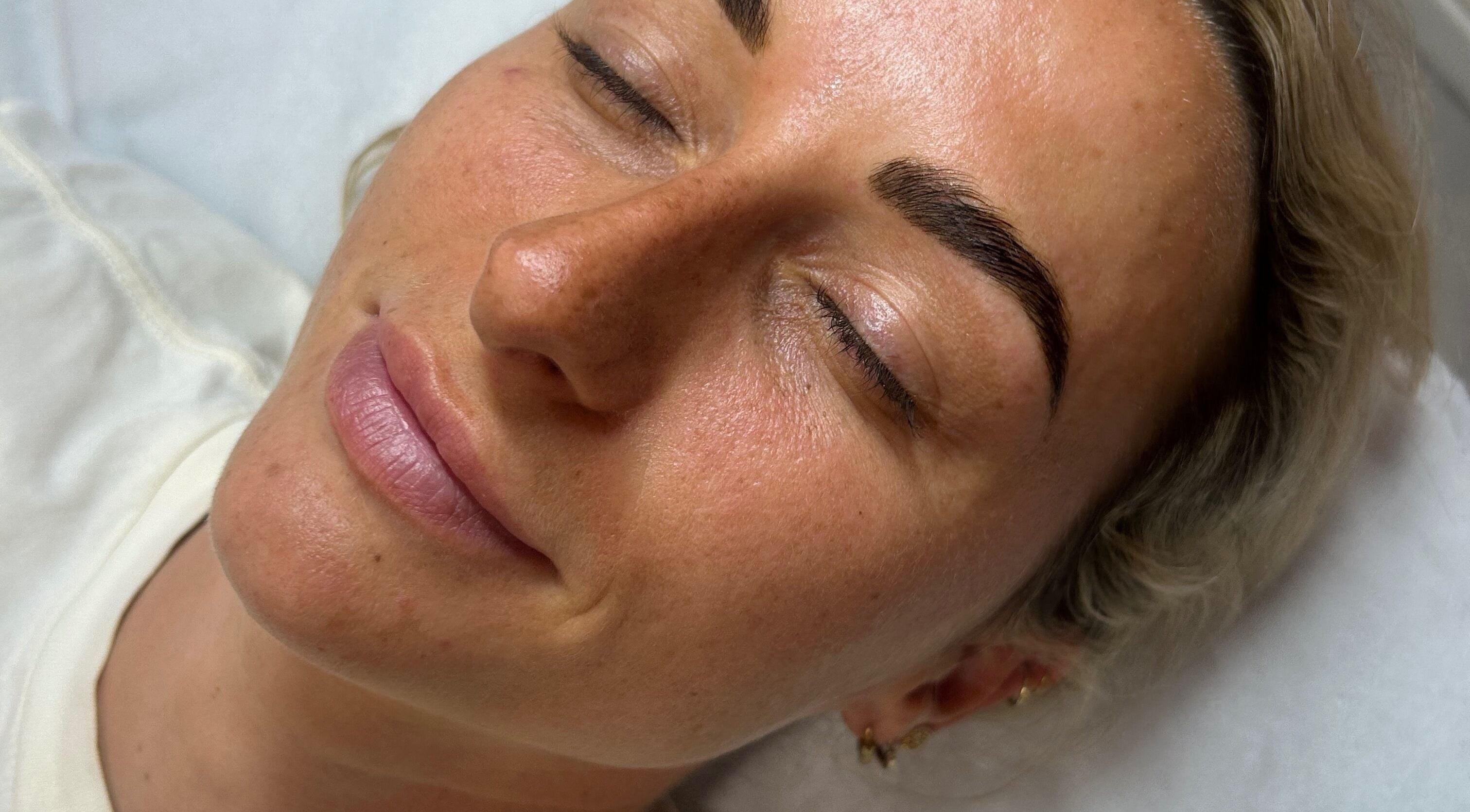 Client enjoys a serene moment after treatment at Lilly Hoffmann permanent cosmetics, Brynhyfryd, Wales, GB.