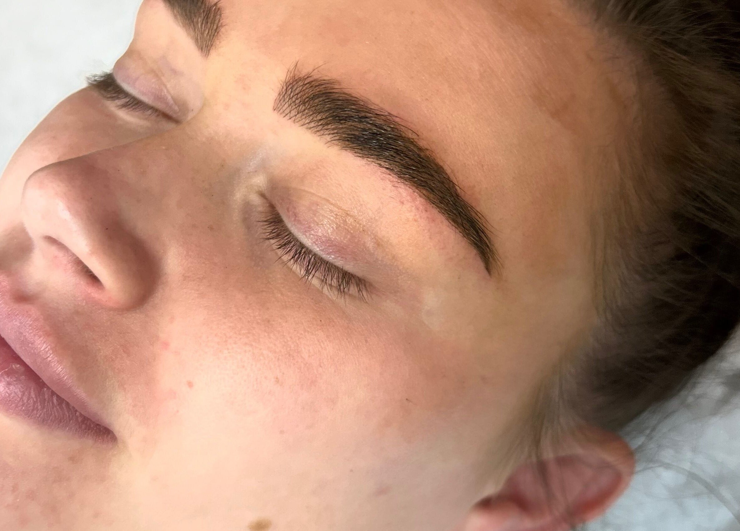Close-up of expertly shaped brows at Lilly Hoffmann permanent cosmetics in Brynhyfryd, Wales, GB.