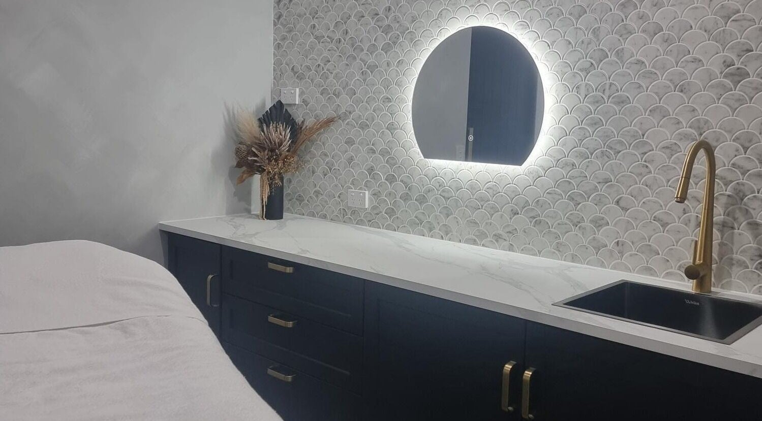 Elegant treatment room at Belle Luxe in Oakford, Western Australia with modern decor and soft lighting.