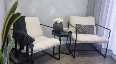Elegant seating area at Belle Luxe, Oakford, Western Australia, AU, featuring plush chairs and decor.