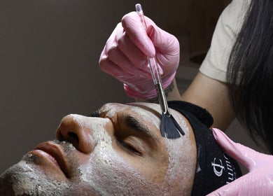 Facial treatment at Illume Cosmetic Clinic, Clayfield, Queensland, AU. Applying mask with brush for relaxation.
