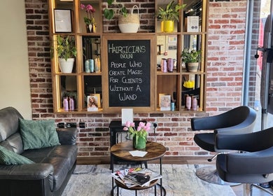 Cozy seating and stylish decor at Care Salon, London, England, GB, showcasing a modern and inviting atmosphere.
