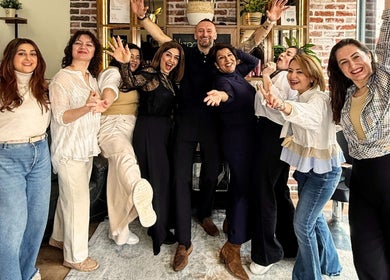 Happy team celebrating at Care Salon in London, England, GB. Inclusive and welcoming environment.