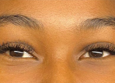 Close-up of expertly styled eyelashes at Omorfia by Amari, Couva, enhancing natural beauty and elegance.