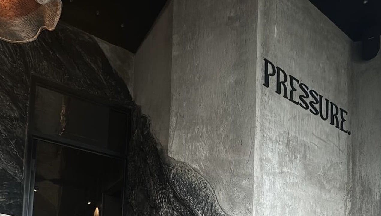 Abstract wall design and 'Pressure' signage at Pressure. Massage Spa Bali, Bali, Bali, ID.