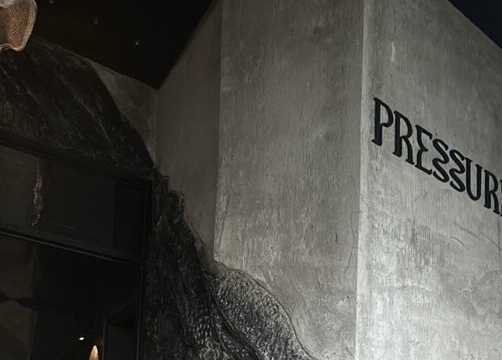 Abstract wall design and 'Pressure' signage at Pressure. Massage Spa Bali, Bali, Bali, ID.