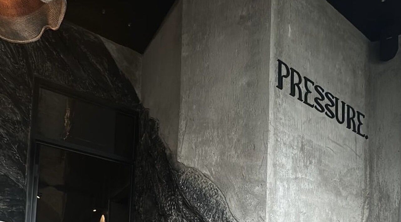 Abstract wall design and 'Pressure' signage at Pressure. Massage Spa Bali, Bali, Bali, ID.