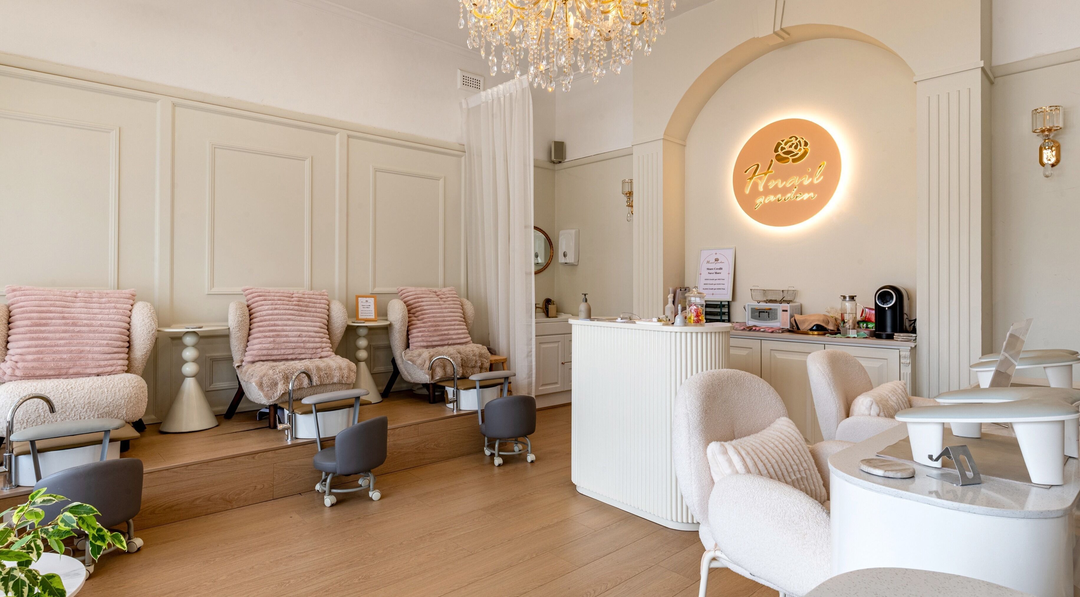 Chic interior of H Nail Garden - Kew East, Melbourne, Victoria, AU with cozy seating and bright decor.