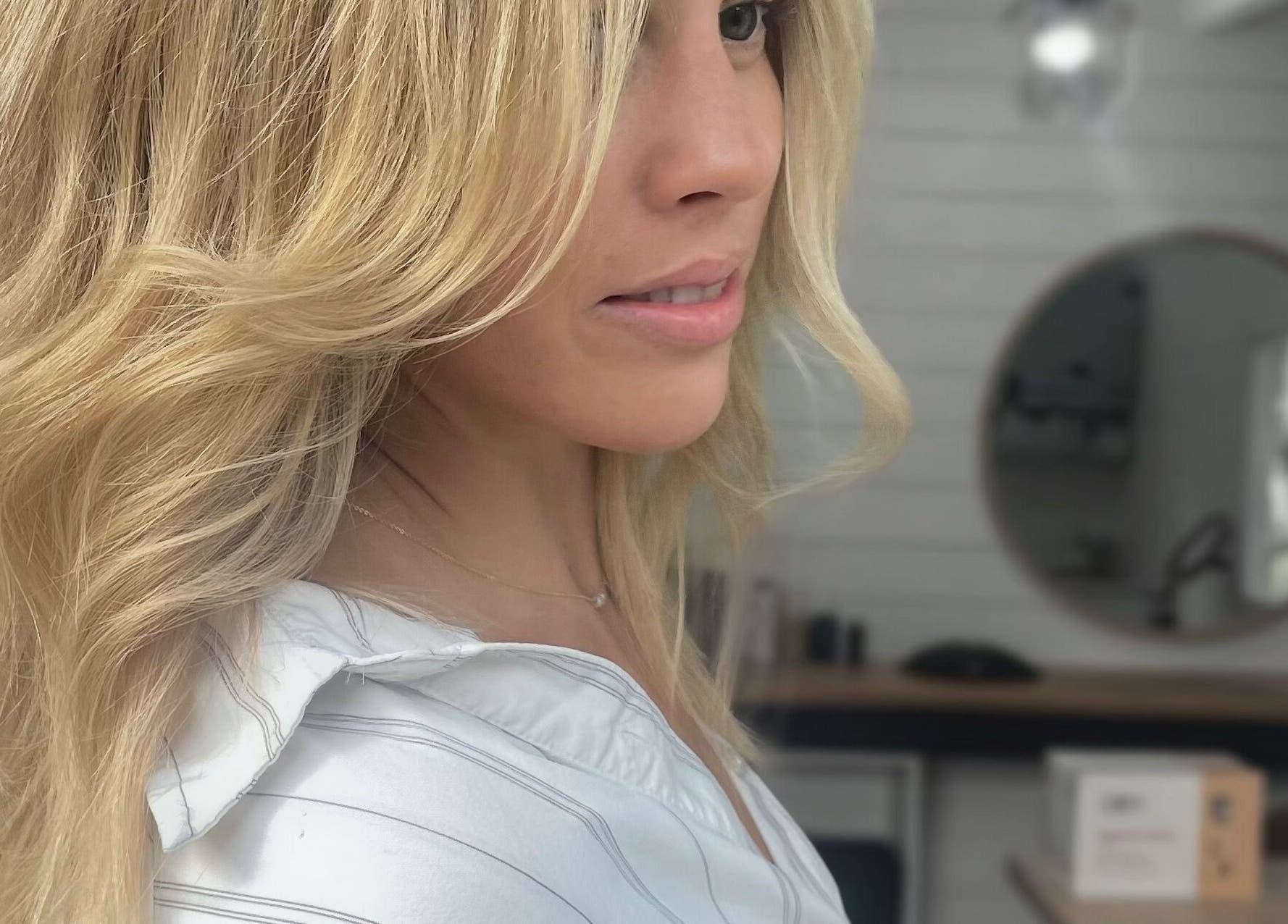 Styled blonde hair at Smiths Lake Hair Studio, New South Wales, AU. Elegant and wavy finish.