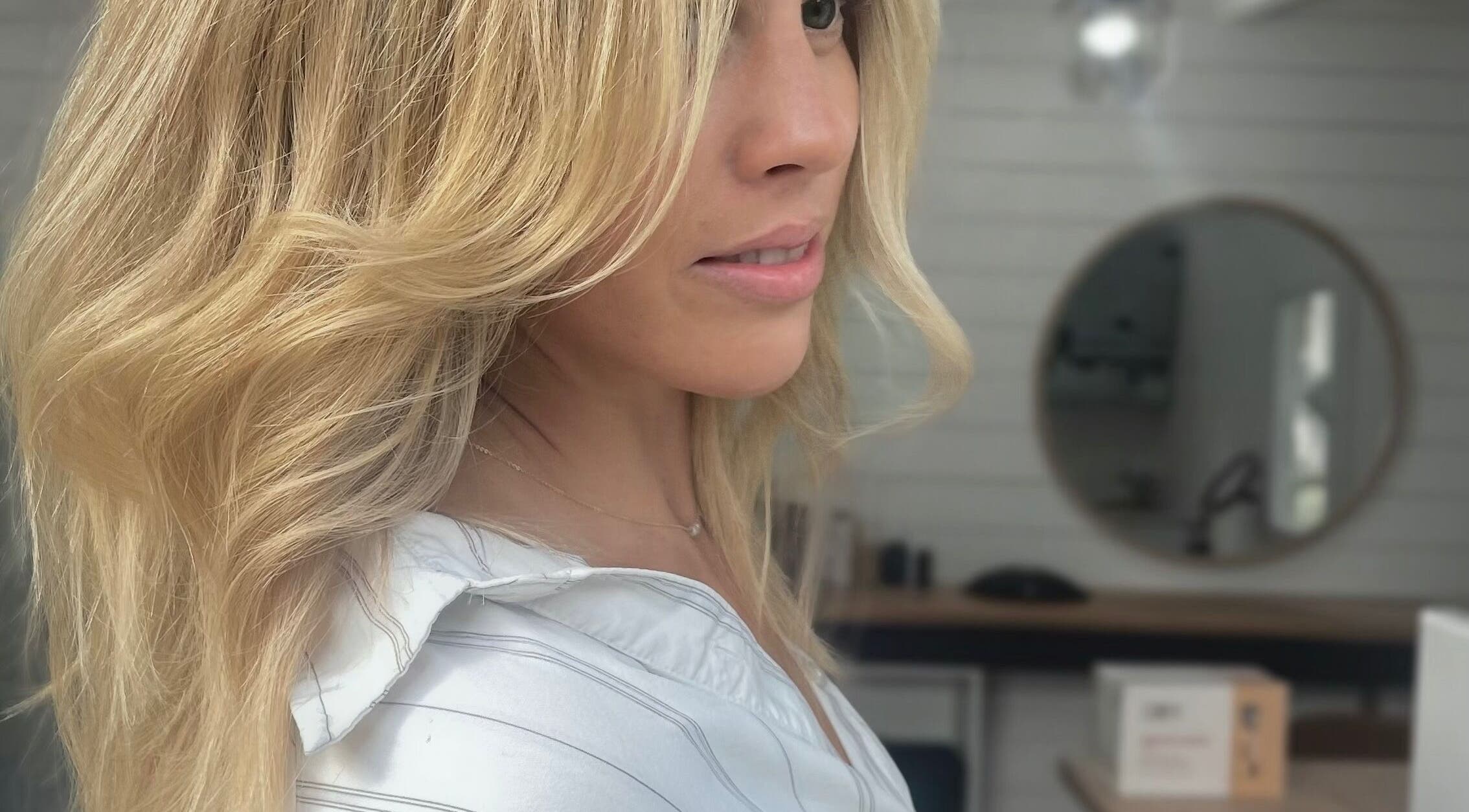 Styled blonde hair at Smiths Lake Hair Studio, New South Wales, AU. Elegant and wavy finish.