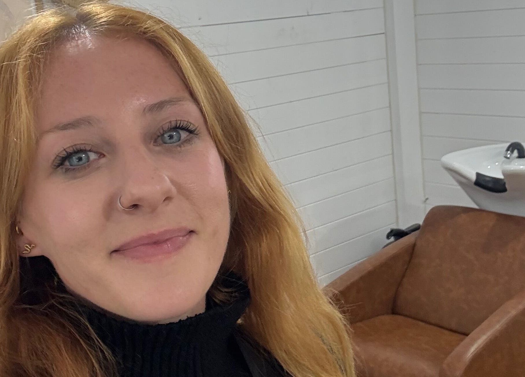 Stylist at Smiths Lake Hair Studio, Smiths Lake, New South Wales, AU in a chic interior with washing station.