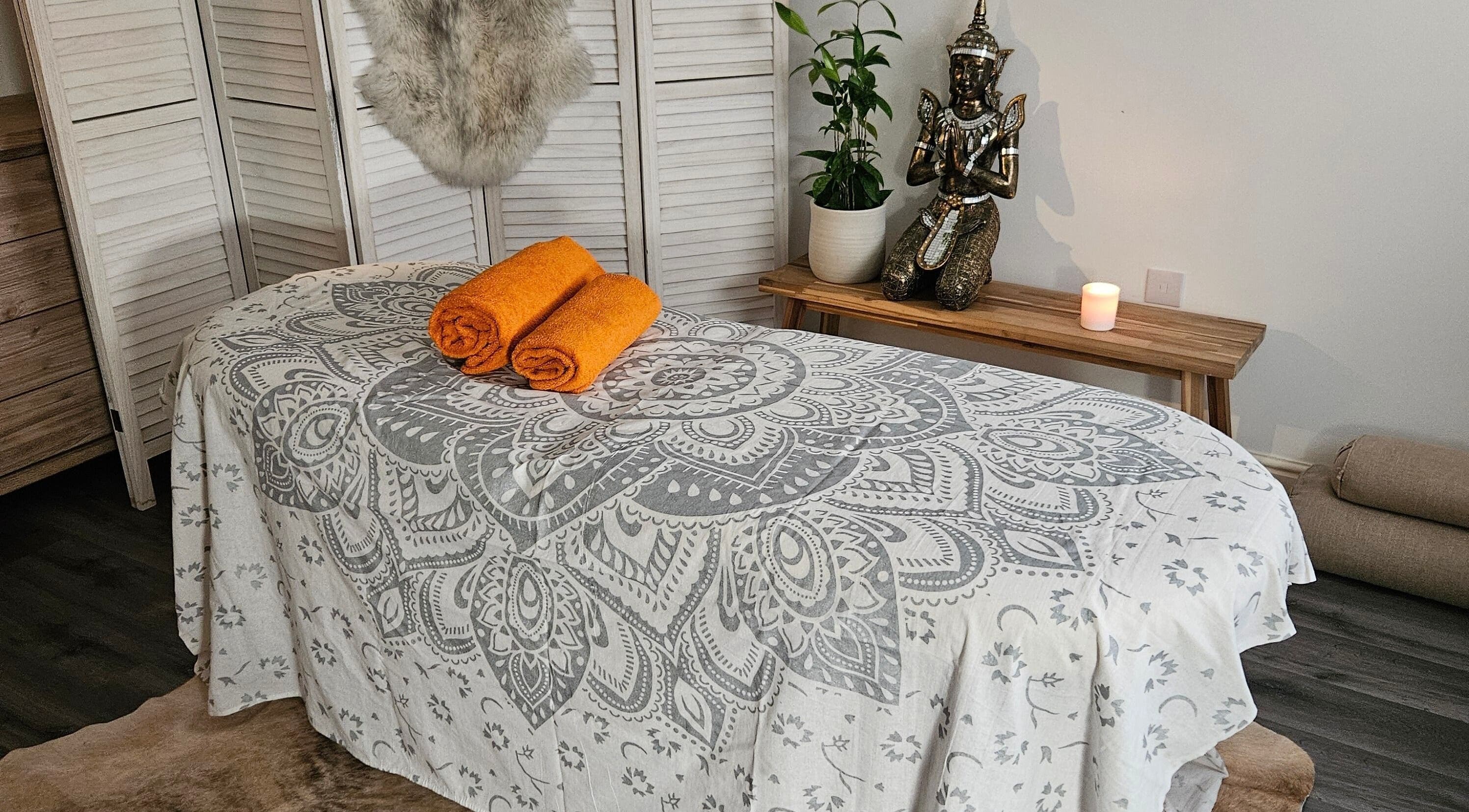 Cozy massage setup at Joanna & The Healing Arts, Marlborough, England, GB, featuring elegant decor and warm towels.