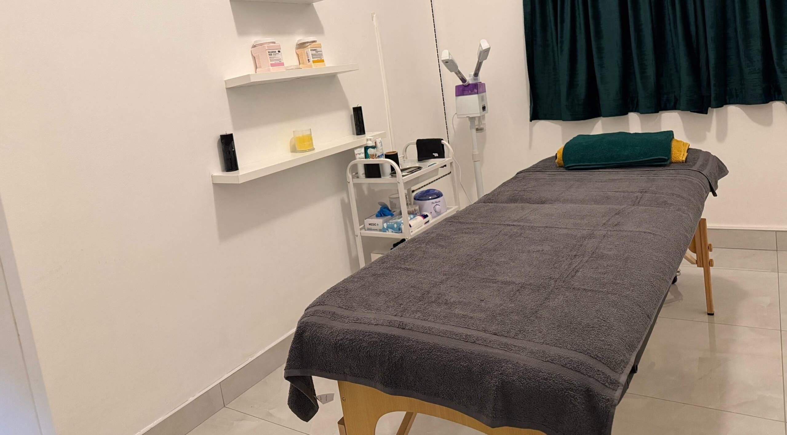 Tranquil massage room at Emerald Spa & Wellness Centre, Windhoek, Khomas Region, NA, featuring cozy amenities.