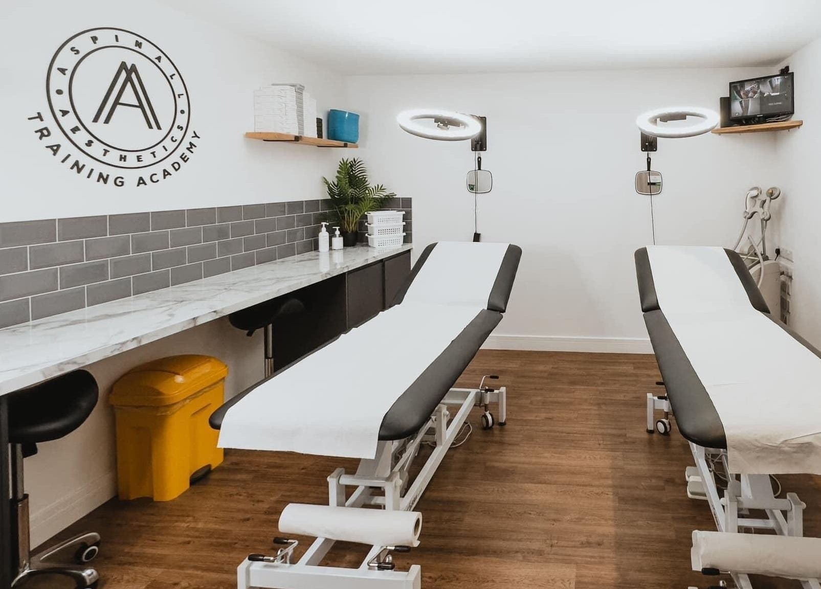 Modern treatment room at Aspinall Aesthetics in Kingswood, England, GB with professional setup.