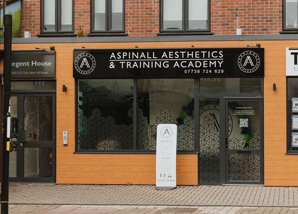 Front view of Aspinall Aesthetics in Kingswood, England featuring modern signage.