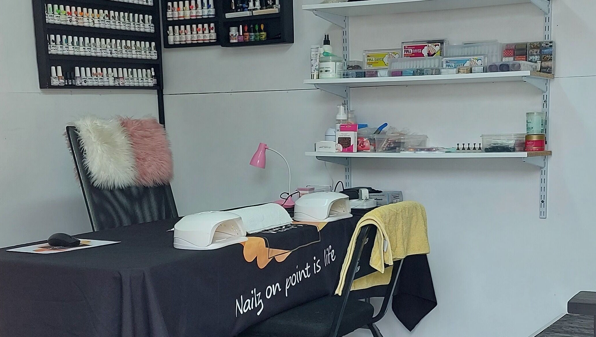 Nail station at Touché Beauty Lab in Cape Town, Western Cape, ZA with elegant setup and polish display.