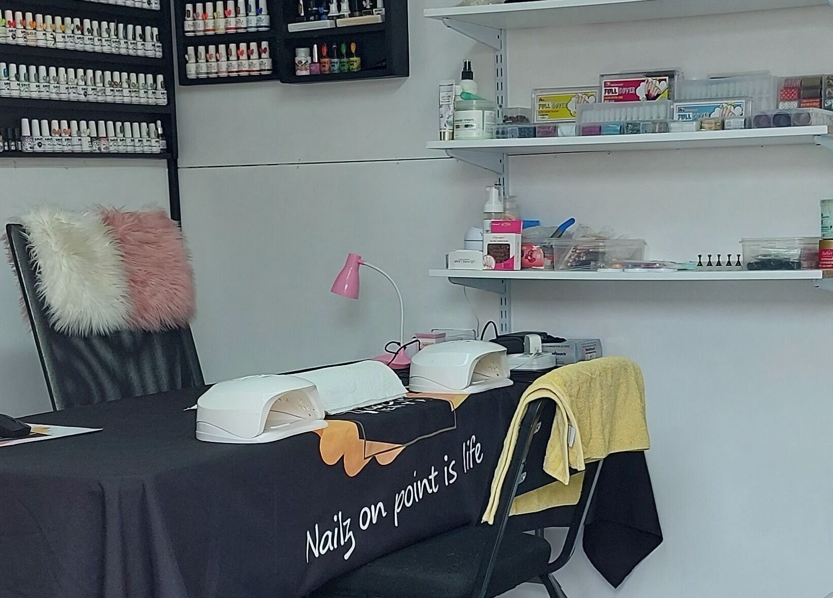 Nail station at Touché Beauty Lab in Cape Town, Western Cape, ZA with elegant setup and polish display.