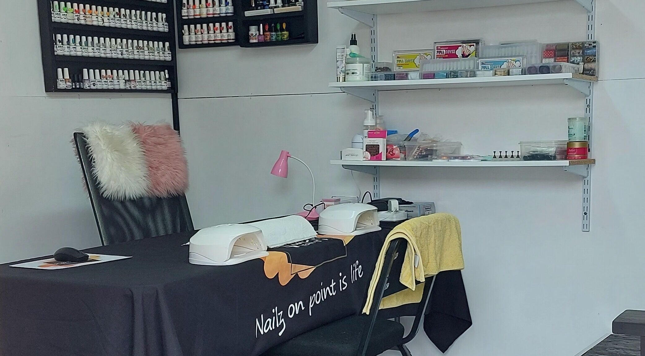 Nail station at Touché Beauty Lab in Cape Town, Western Cape, ZA with elegant setup and polish display.