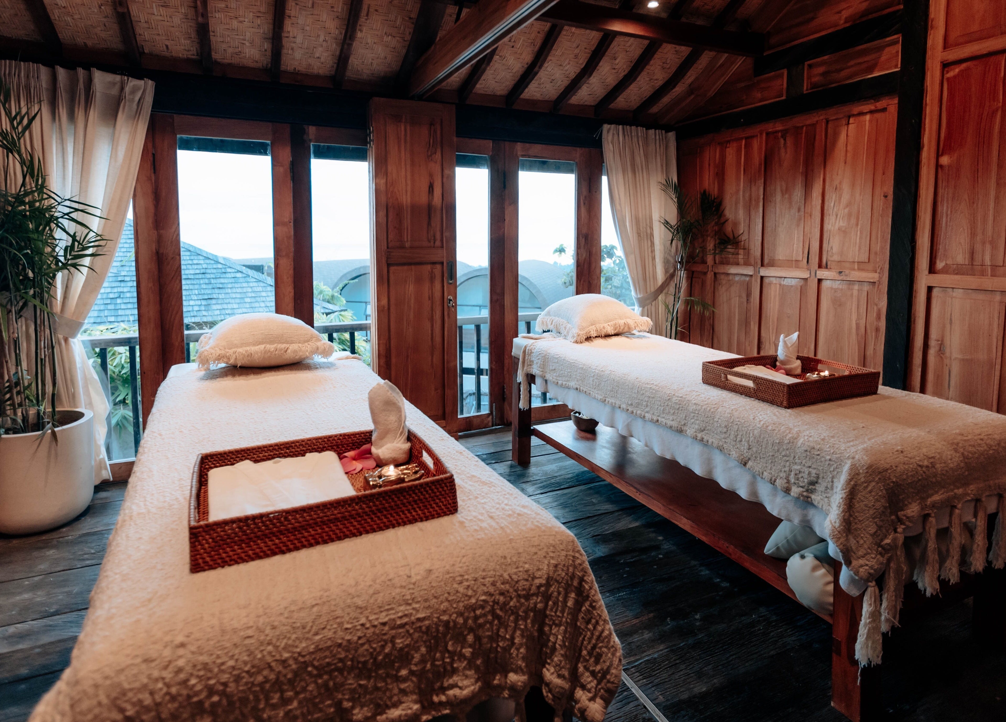 Cozy massage room at Hidden Gem Spa Uluwatu, Bali, featuring twin beds and serene decor in Bali, Bali, ID.