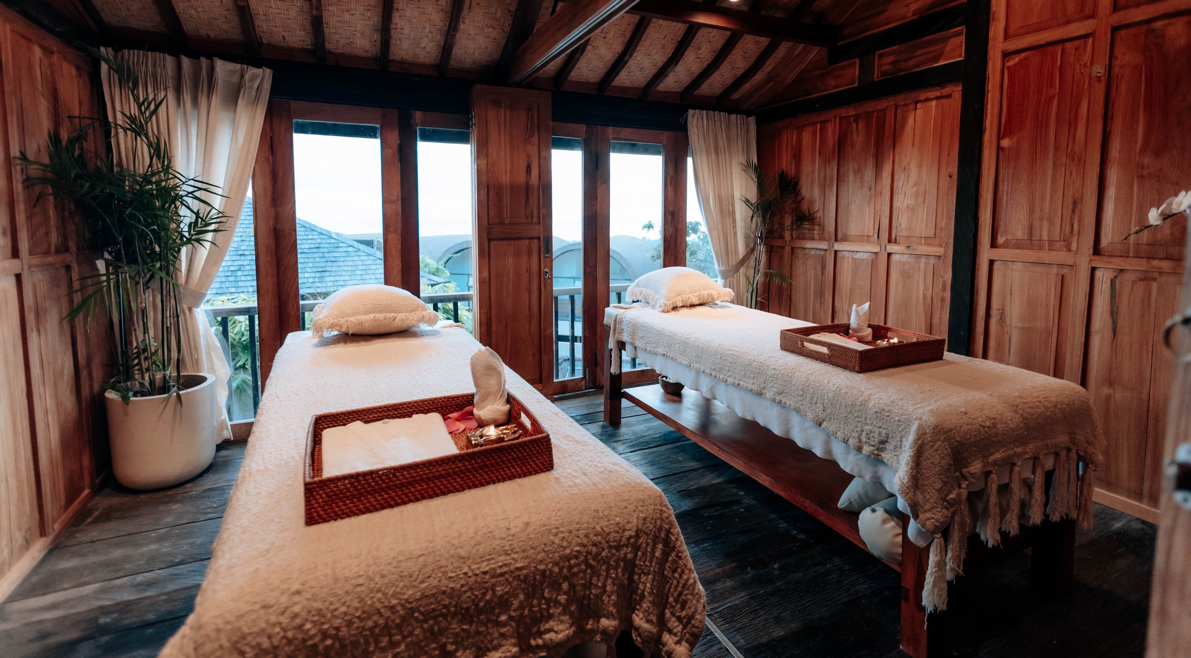 Cozy massage room at Hidden Gem Spa Uluwatu, Bali, featuring twin beds and serene decor in Bali, Bali, ID.