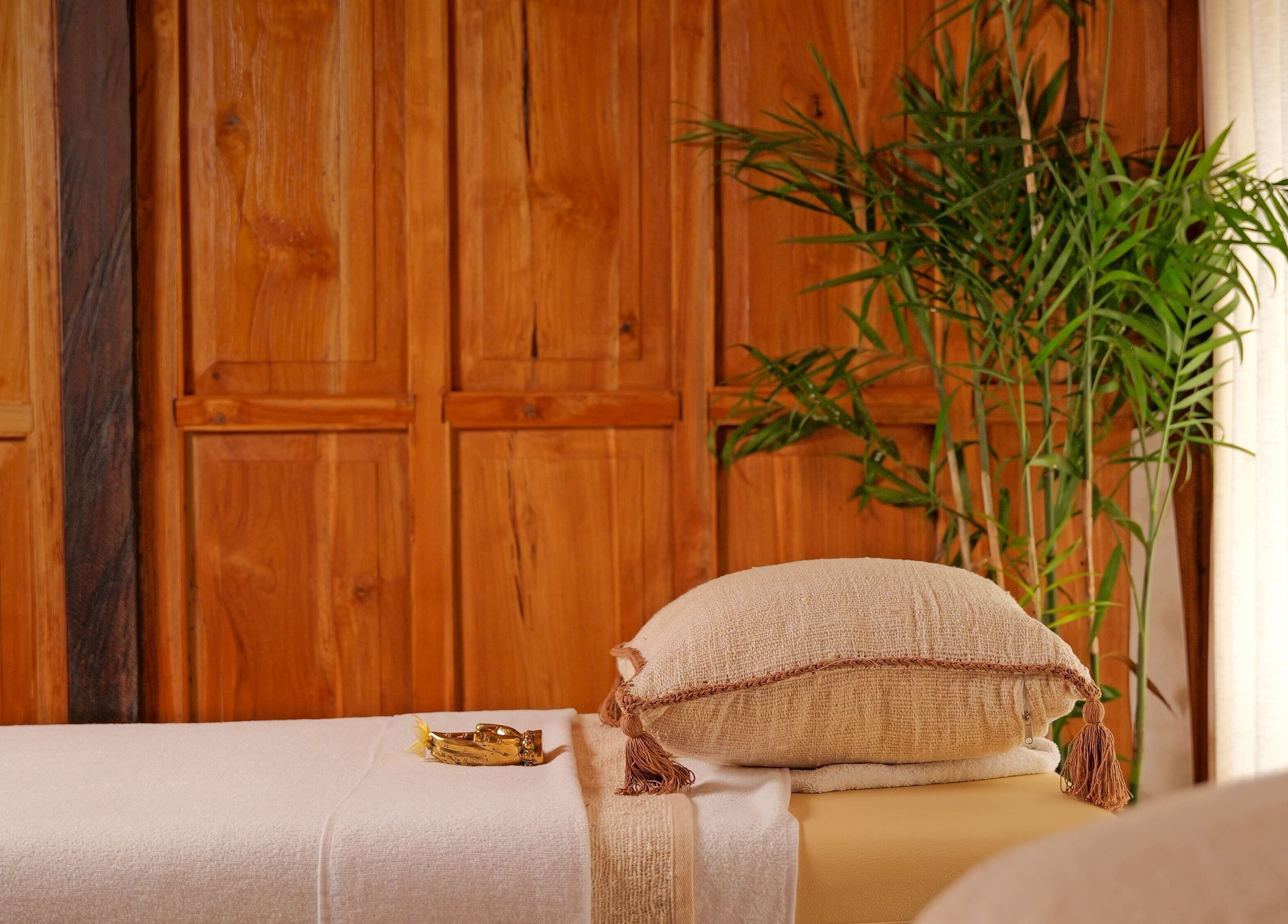 Relaxing massage table at Hidden Gem Spa Uluwatu, Bali, Bali, ID with plush pillow and peaceful decor.
