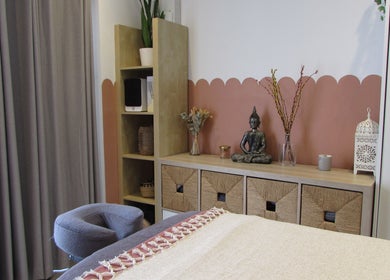 Tranquil treatment room at Laura Jane Holistic, Bristol, England, GB, featuring a serene Buddha statue.