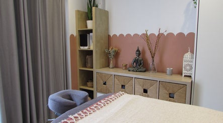Tranquil treatment room at Laura Jane Holistic, Bristol, England, GB, featuring a serene Buddha statue.
