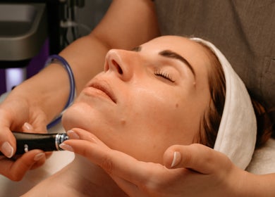 Facial treatment at The Dermal Collection, Cape Town, Western Cape, ZA enhances skin glow and relaxation.