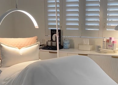 Luxurious spa bed at The Dermal Collection, Cape Town, Western Cape, ZA, showcasing modern wellness essentials.