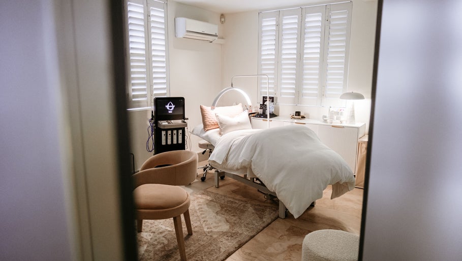 Elegant treatment room at The Dermal Collection, Cape Town, Western Cape, ZA, showcasing a relaxing spa bed.
