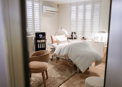 Elegant treatment room at The Dermal Collection, Cape Town, Western Cape, ZA, showcasing a relaxing spa bed.