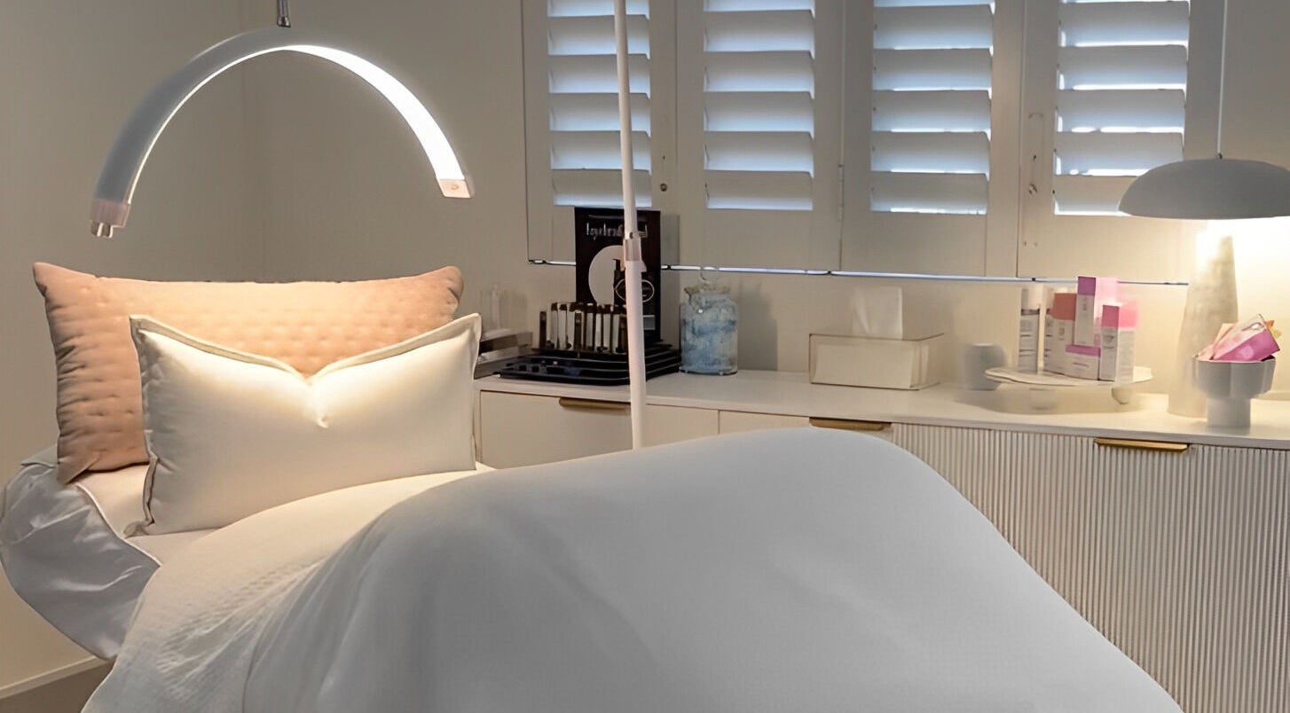 Tranquil treatment room at The Dermal Collection, Cape Town, Western Cape, ZA, featuring cozy pillows.