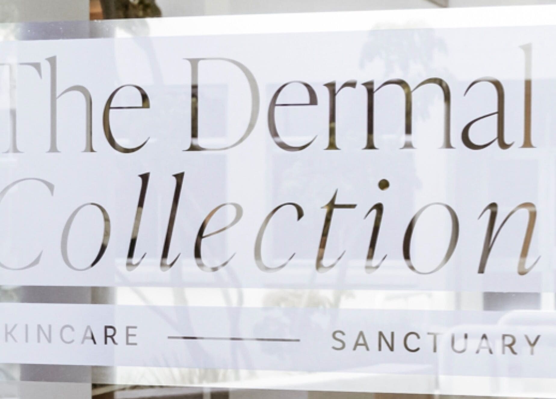 The Dermal Collection signage in Cape Town, Western Cape, ZA, showcasing skincare and sanctuary offerings.