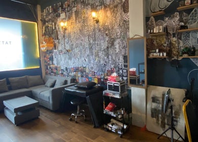 Cozy interior of Devarda INK Tattoo Studio in Bali, Bali, ID, featuring artistic decor and comfortable seating.