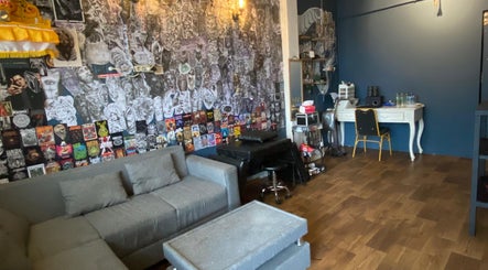 Stylish interior of Devarda INK Tattoo Studio in Bali, Bali, ID featuring creative wall art and cozy seating.