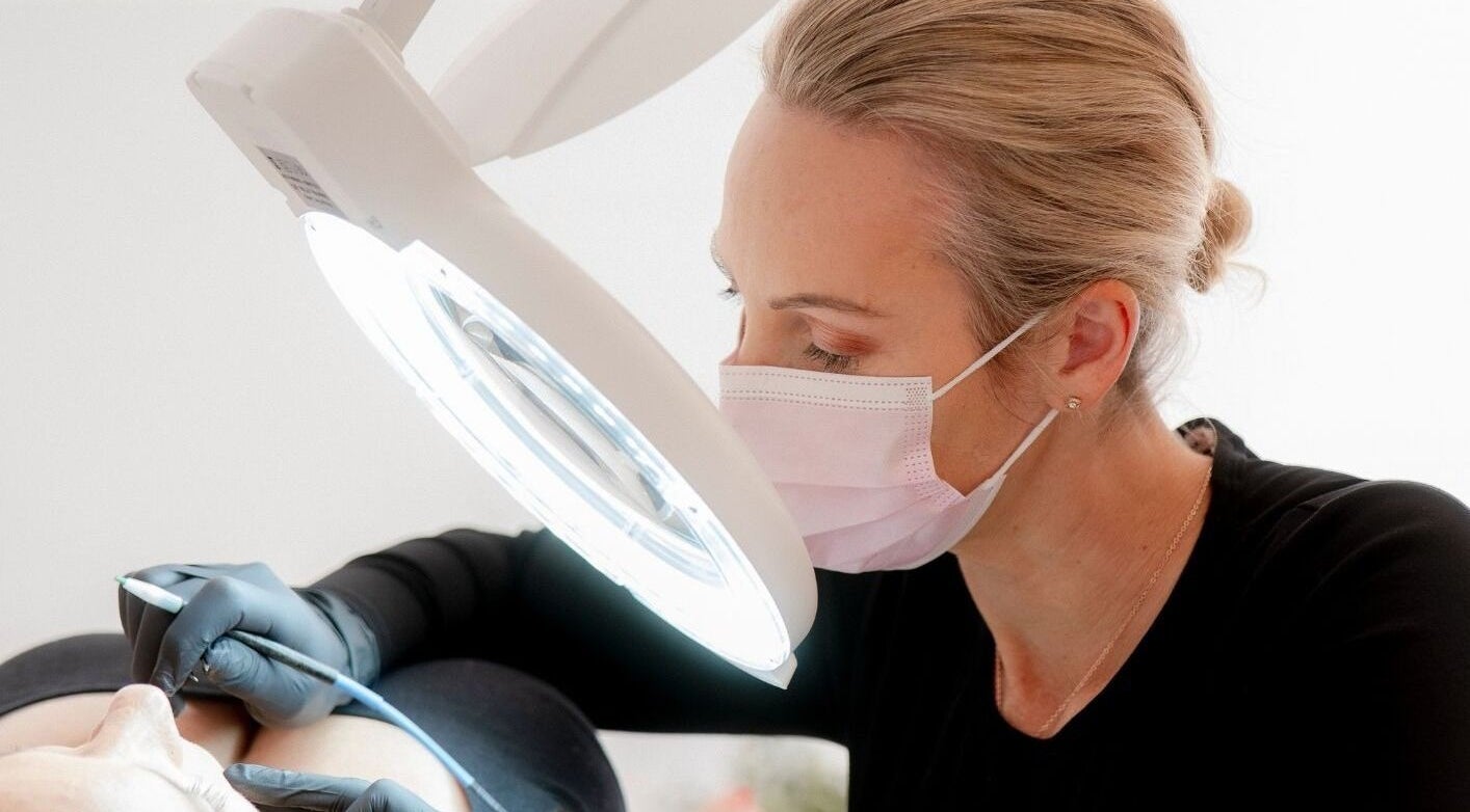 Electrologist at Liberation Electrolysis, Worthing, England, GB, performing precise treatment.