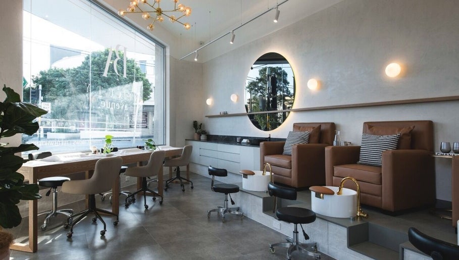 Stylish salon interior at Cosmetics by Nurse Juliette, Alexandria, New South Wales, AU, with plush seating.