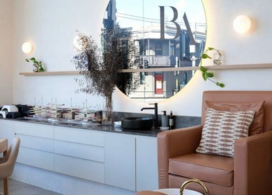 Chic beauty studio at Cosmetics by Nurse Juliette, Alexandria, New South Wales, AU with cozy seating and modern decor.