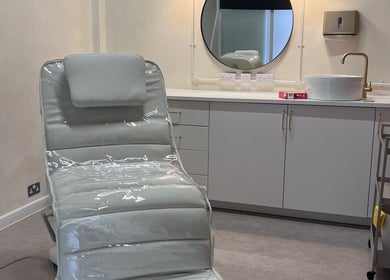 Treatment room at NL Aesthetics, Worcester, England, GB, featuring a plush chair and modern sink setup.
